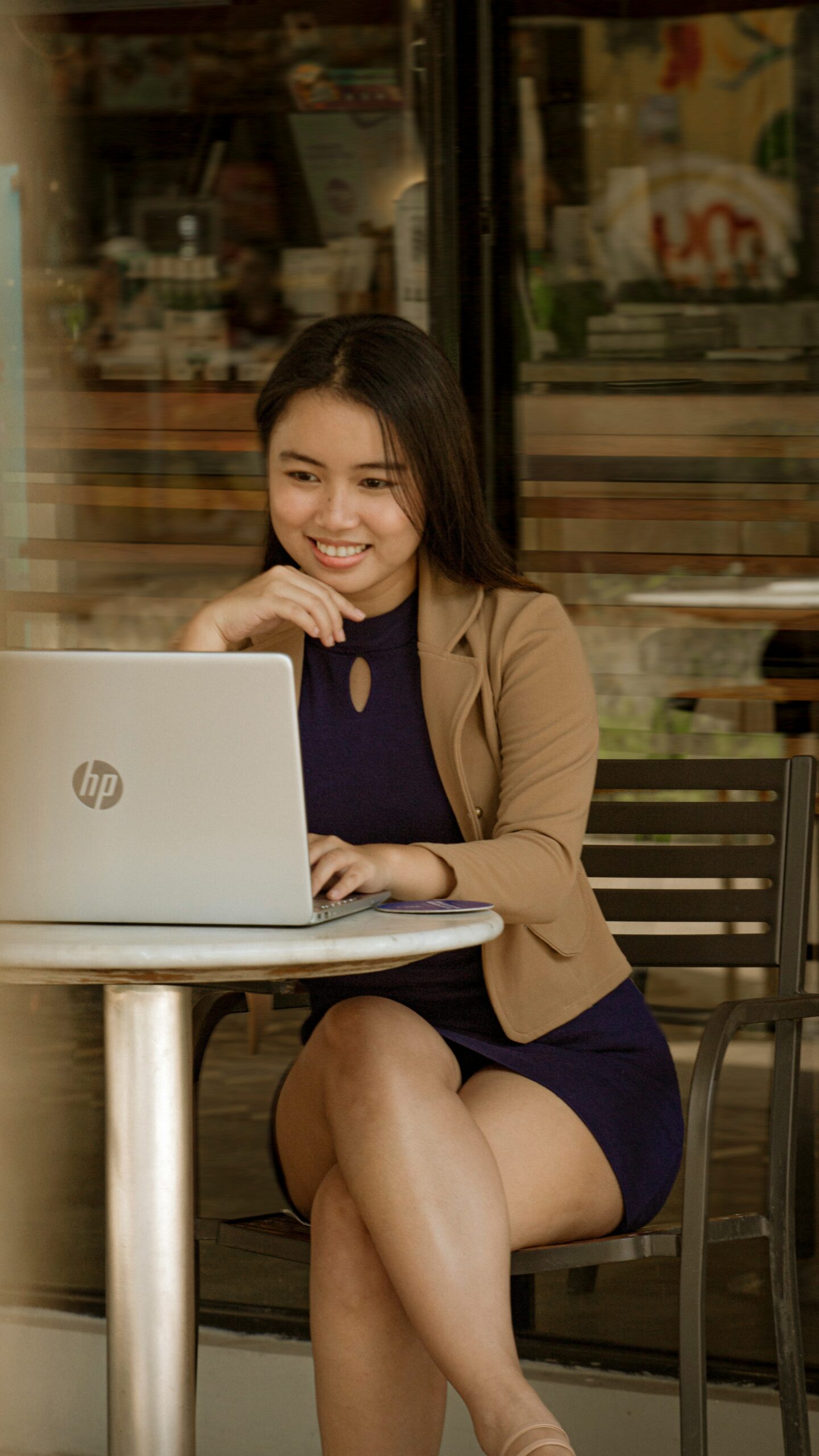 Smiling woman using laptop
